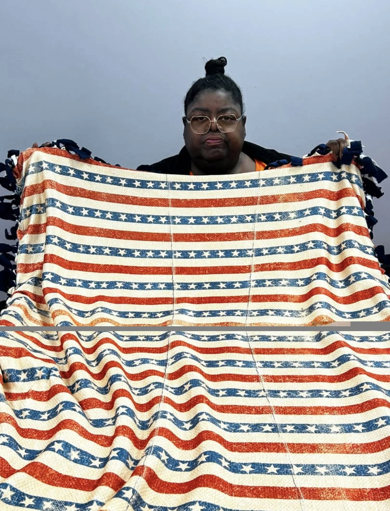 Volunteer holding a finished patriotic stars and stripes no-sew blanket at the BV Mall Senior Center